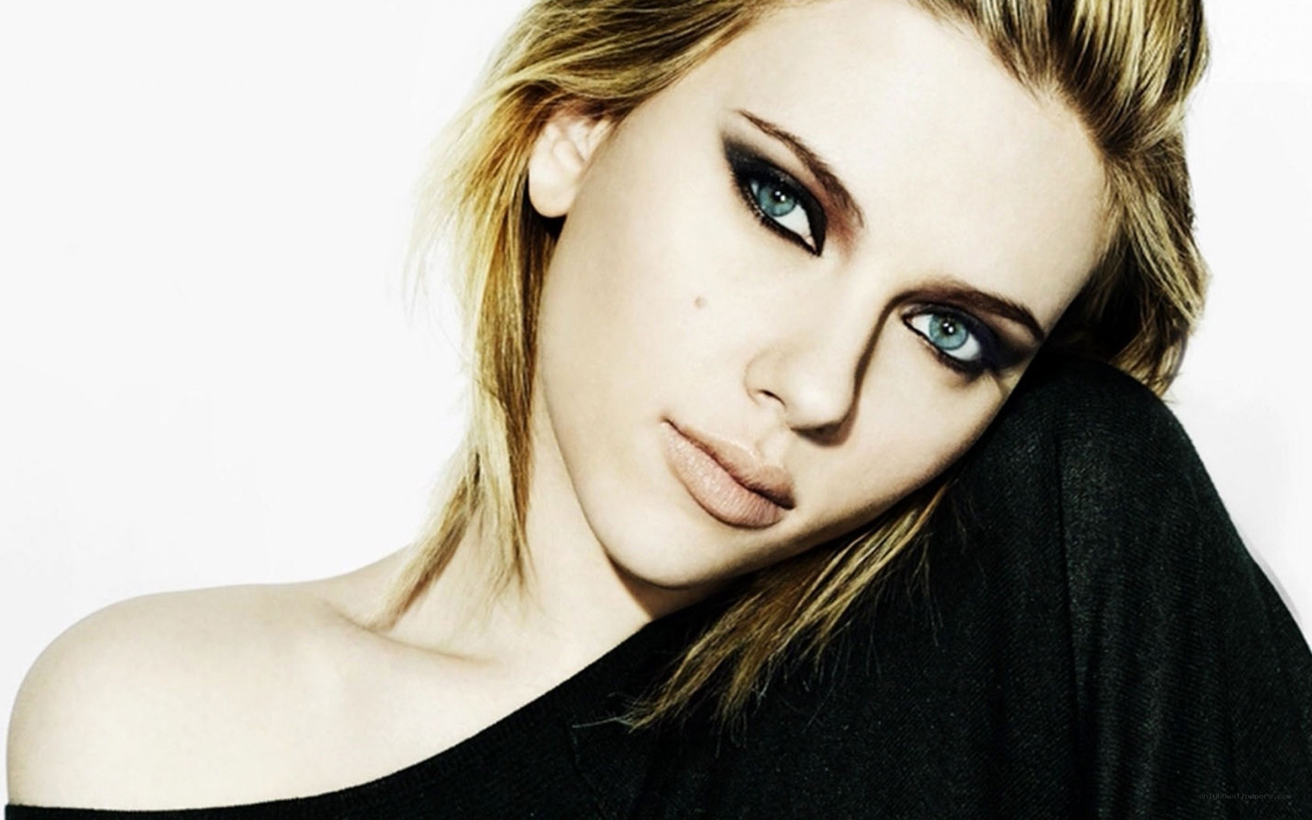 woman with blue eyes and dark makeup