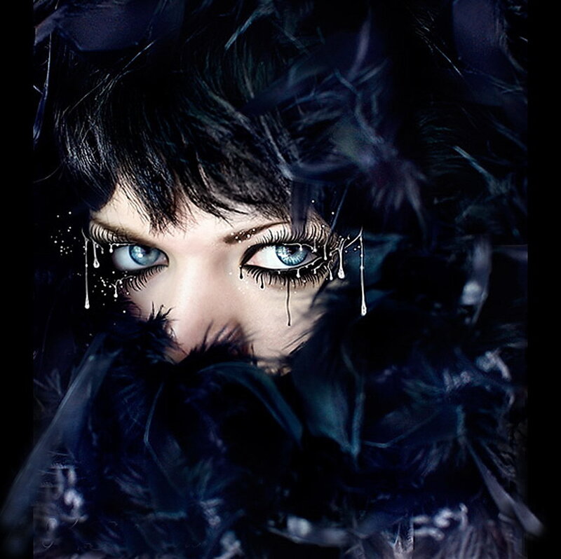 woman with blue eyes and feathers