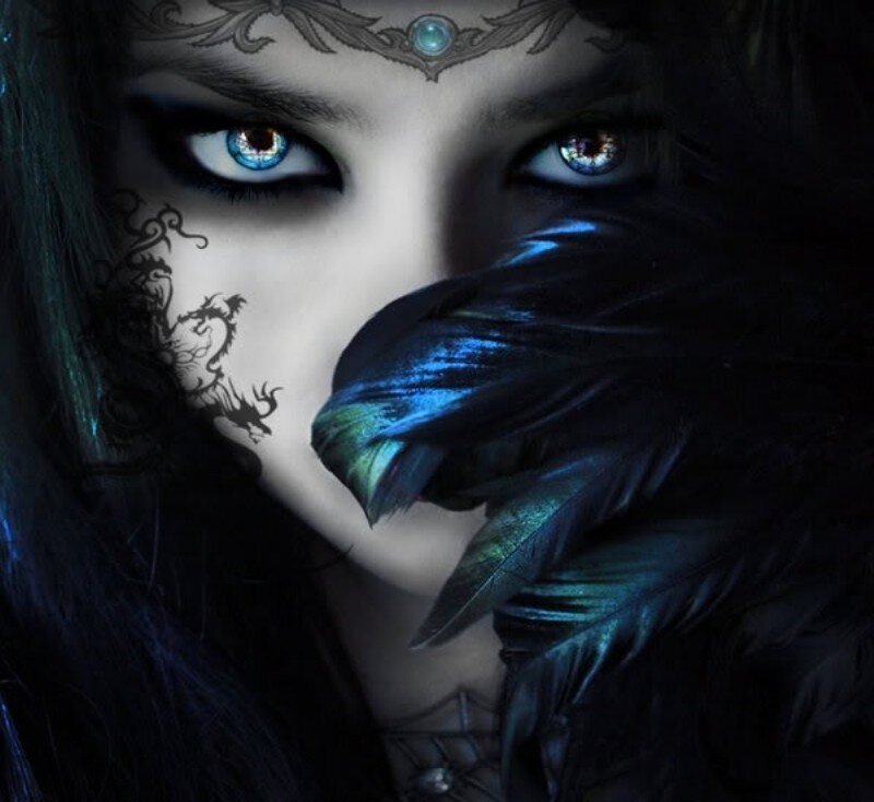 woman with blue eyes and feathers