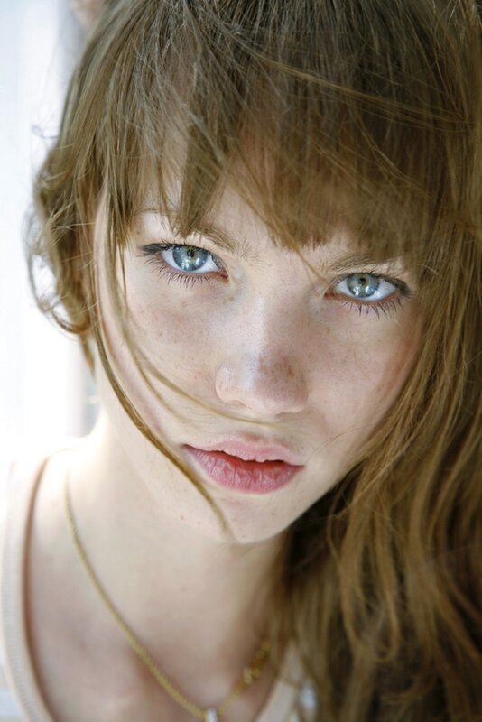 woman with blue eyes and freckles