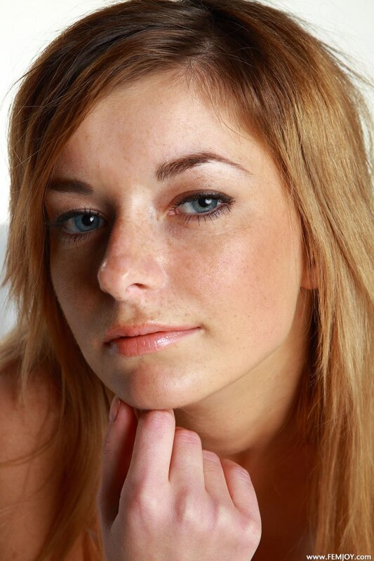 woman with blue eyes and freckles
