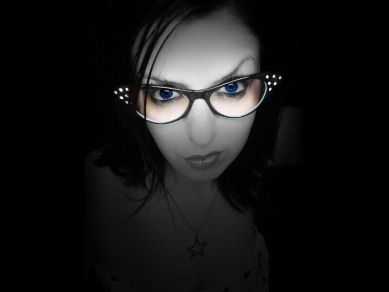 woman with blue eyes and glasses