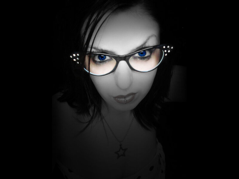 woman with blue eyes and glasses