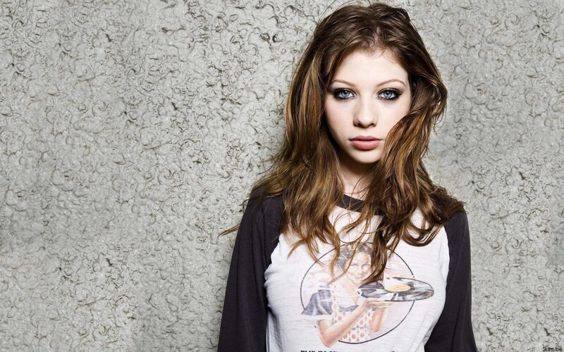 woman with blue eyes and graphic tee