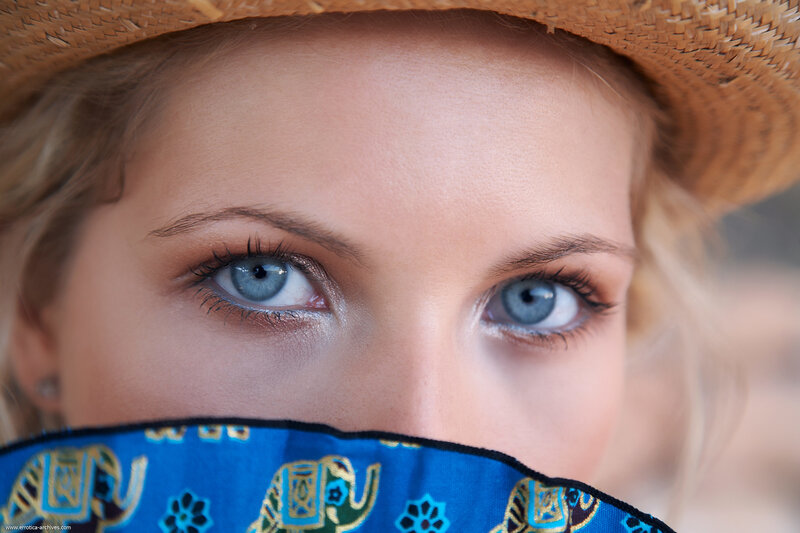 woman with blue eyes and hat
