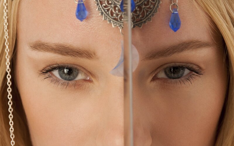 woman with blue eyes and headpiece