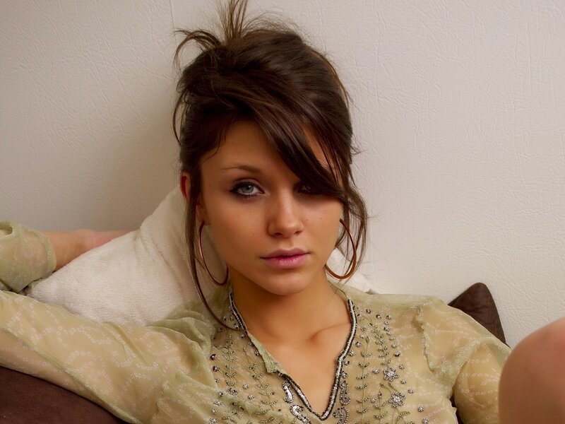 woman with blue eyes and hoop earrings