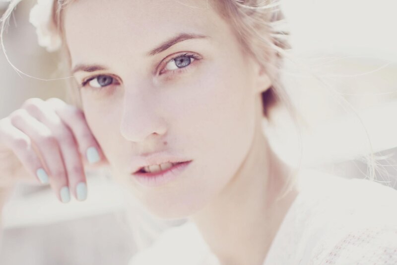 woman with blue eyes and light makeup