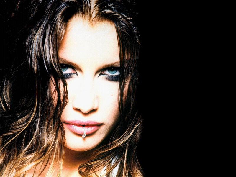 woman with blue eyes and lip ring
