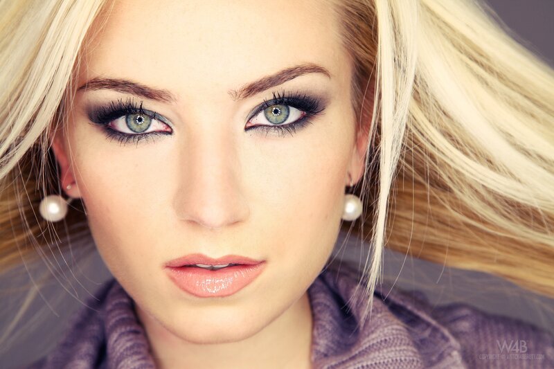 woman with blue eyes and makeup