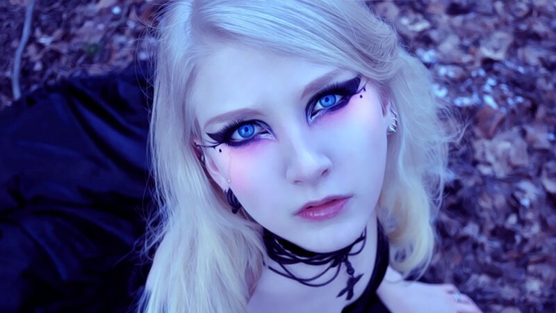 woman with blue eyes and makeup