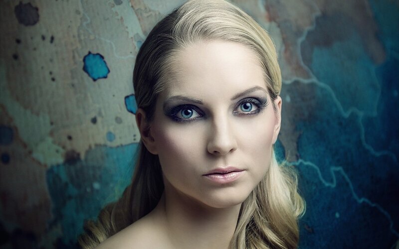 woman with blue eyes and makeup