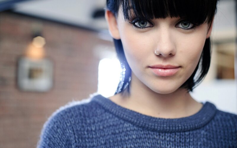 woman with blue eyes and nose ring