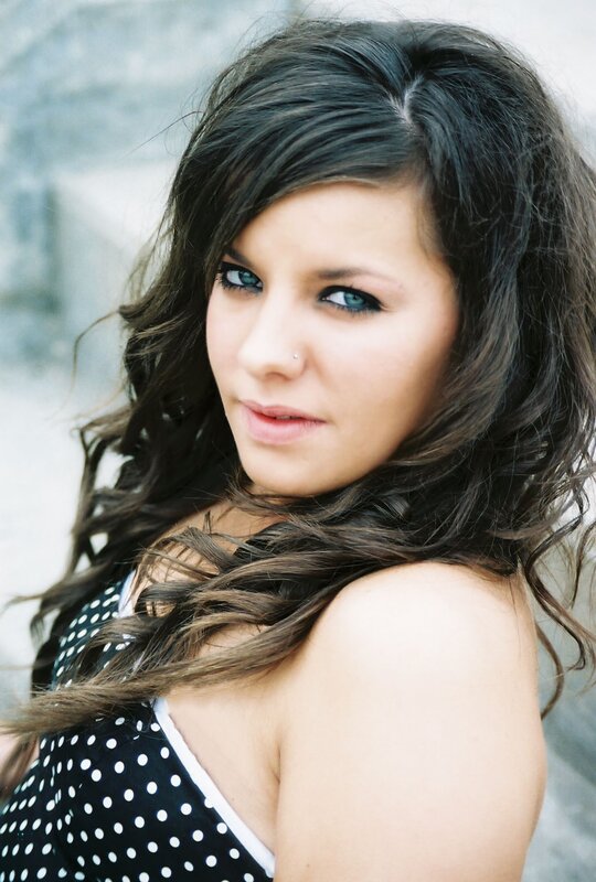 woman with blue eyes and polka dot dress