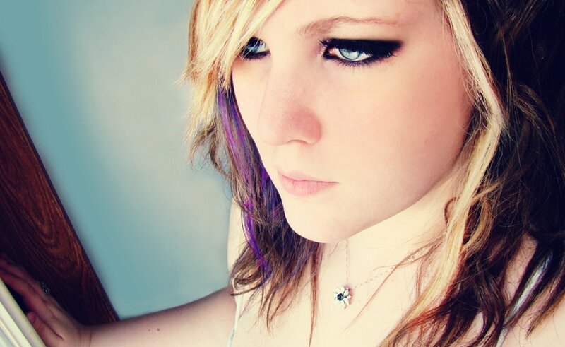 woman with blue eyes and purple hair
