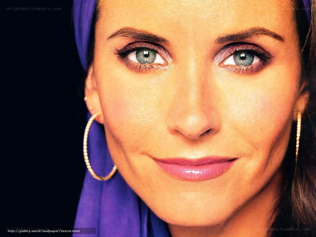 woman with blue eyes and purple headscarf