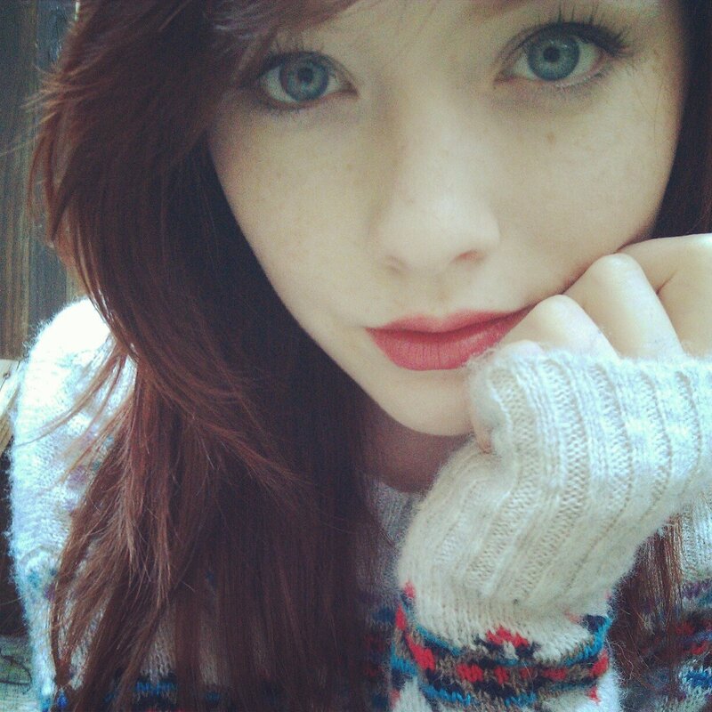 woman with blue eyes and red hair