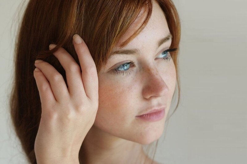 woman with blue eyes and red hair