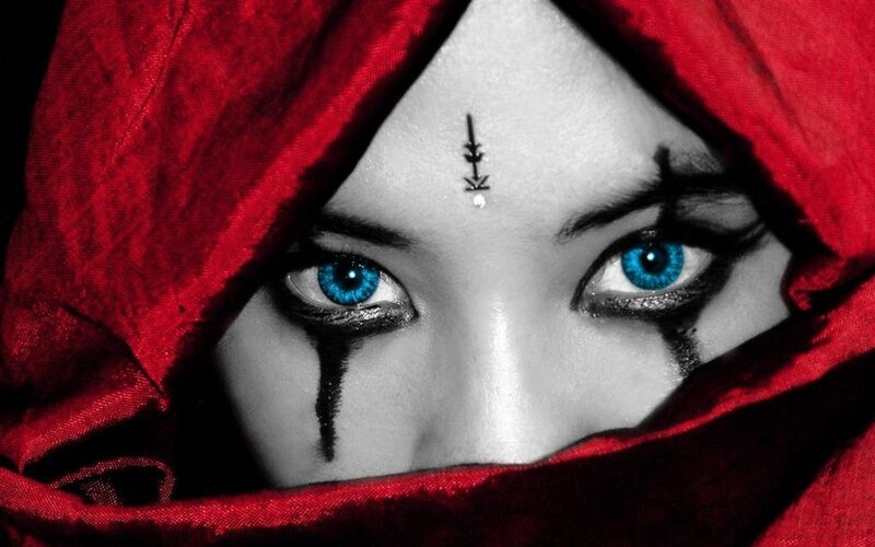 woman with blue eyes and red hood