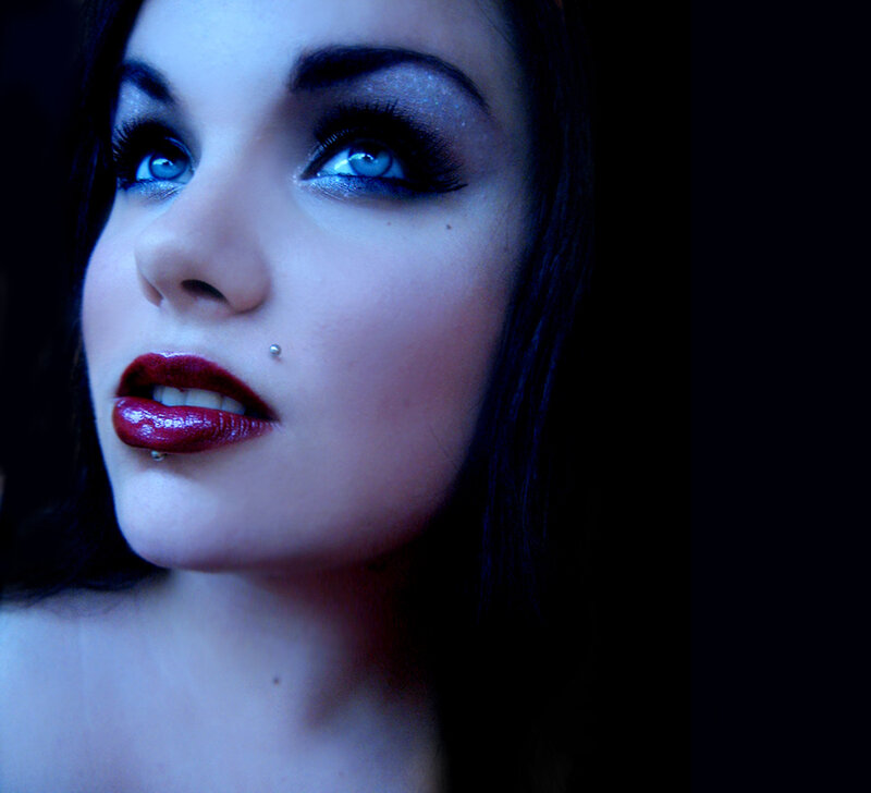 woman with blue eyes and red lips