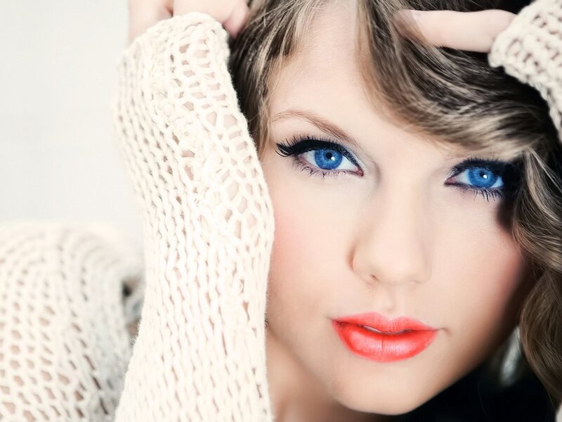 woman with blue eyes and red lipstick