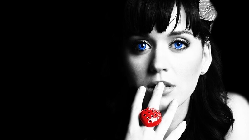 woman with blue eyes and red ring
