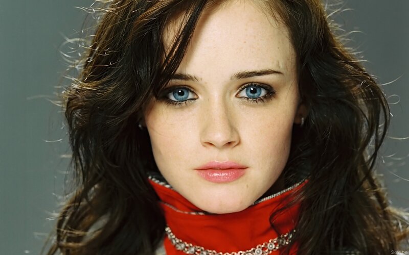 woman with blue eyes and red scarf