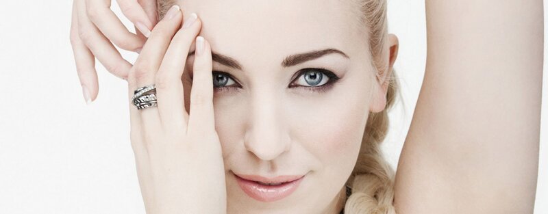 woman with blue eyes and rings