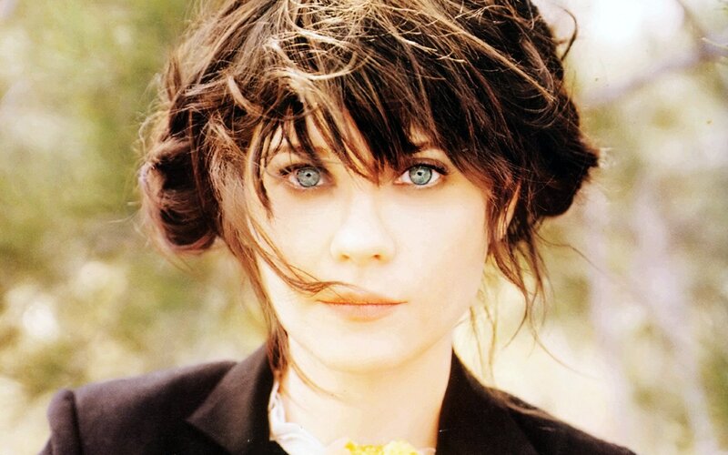 woman with blue eyes and tousled hair