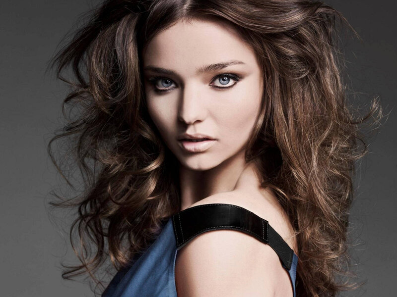 woman with blue eyes and wavy hair