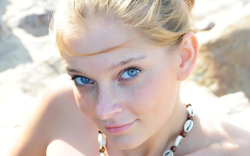 woman with blue eyes at beach