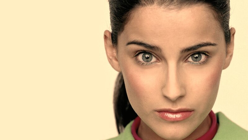 Woman with Blue Eyes — Beige, Neutral, Photograph, Green Jacket