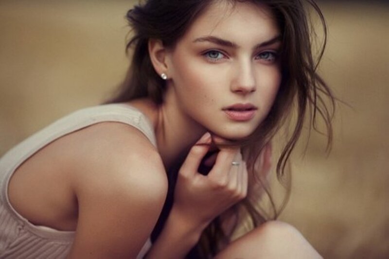 Woman with Blue Eyes — Brown, Contemplative