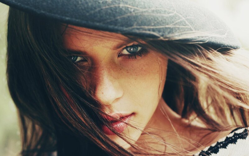 Woman with Blue Eyes — Brown, Dramatic, Photograph, Hat