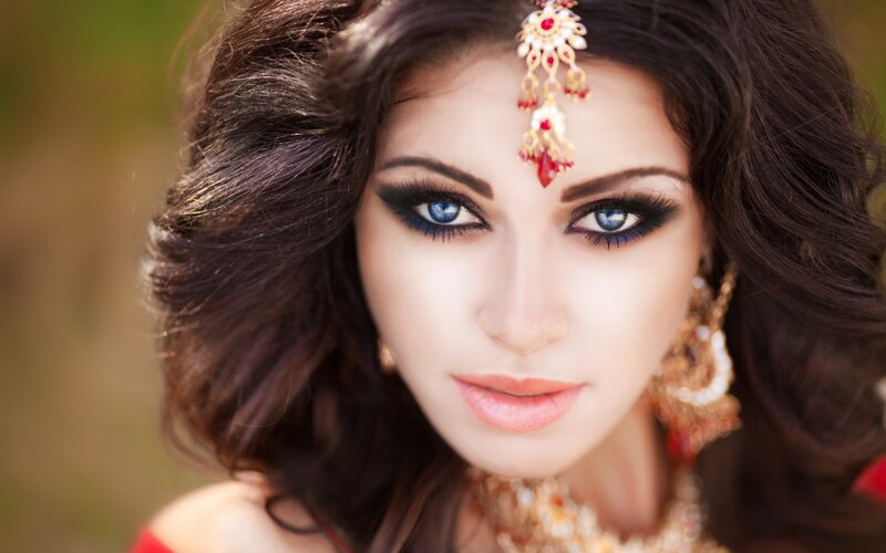 Woman with Blue Eyes — Brown, Dramatic, Photograph, Jewelry