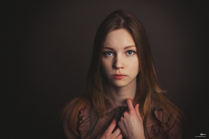 Woman with Blue Eyes — Brown, Dramatic, Photograph, Long Hair, Dark Background