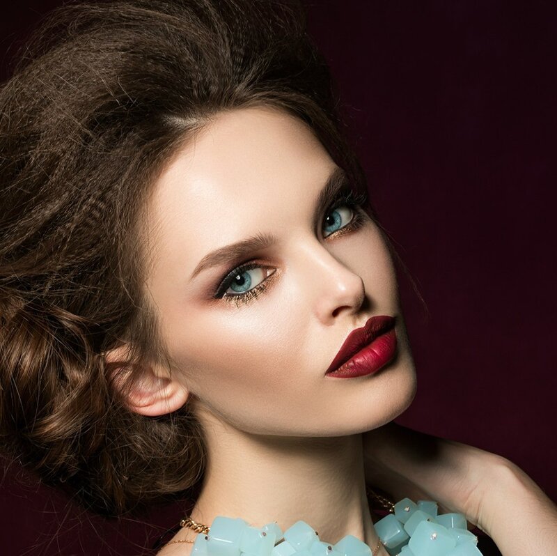Woman with Blue Eyes — Brown, Dramatic, Photograph, Makeup, Necklace
