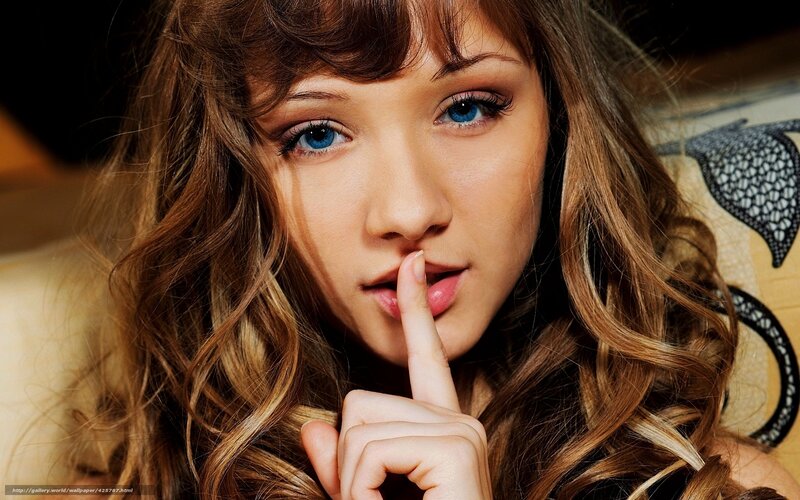 Woman with Blue Eyes — Brown, Intimate, Photograph, Finger, Couch