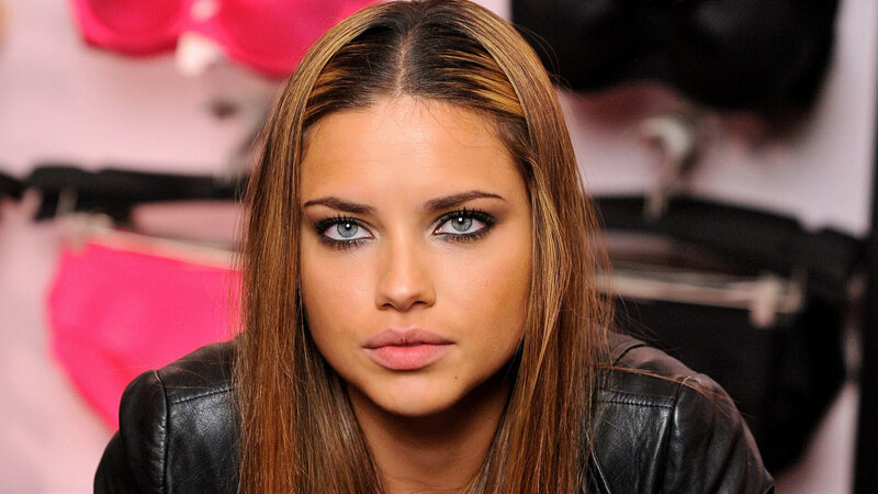 Woman with Blue Eyes — Brown, Serious, Photograph, Leather Jacket