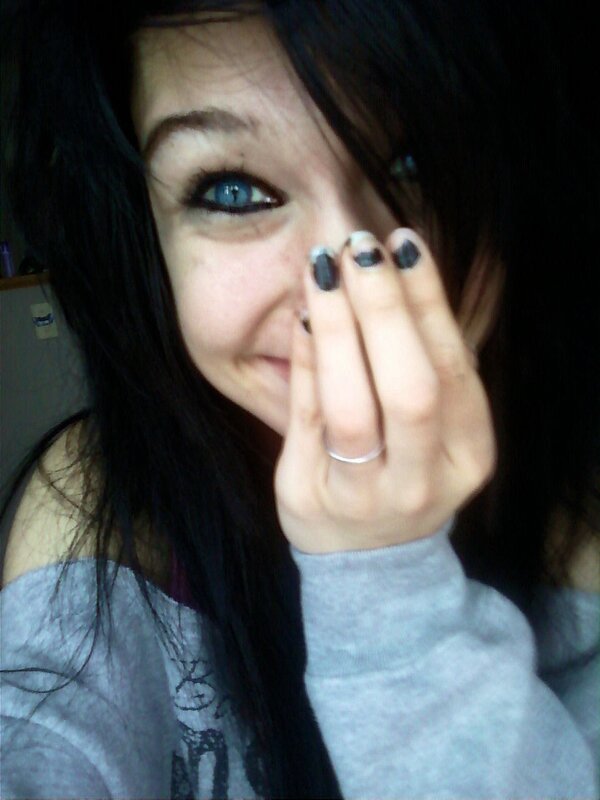 woman with blue eyes covering face