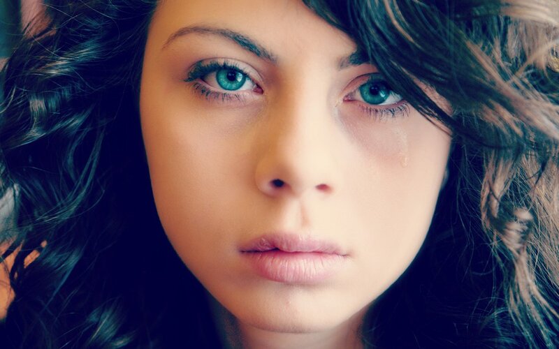 woman with blue eyes crying