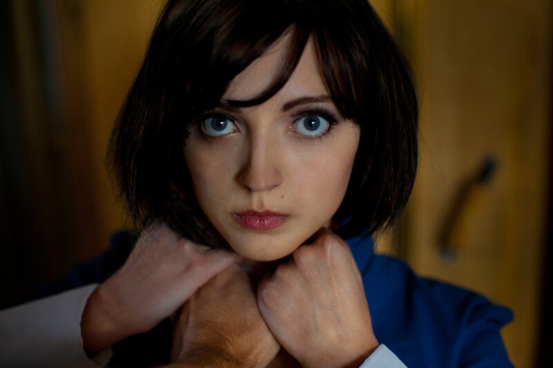 woman with blue eyes in a tense pose