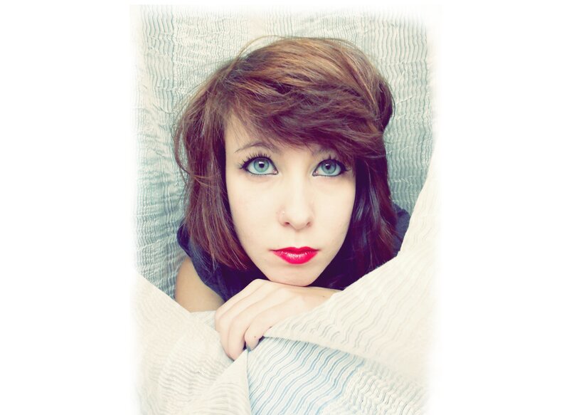 woman with blue eyes in bed