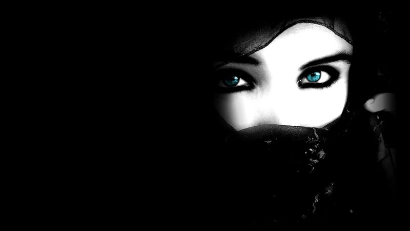woman with blue eyes in dark