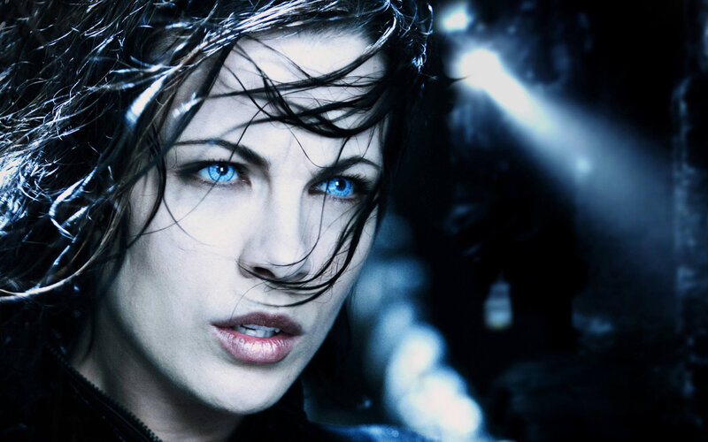woman with blue eyes in dark scene