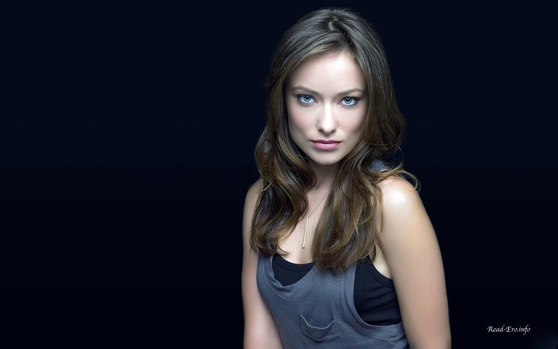 woman with blue eyes in dark setting