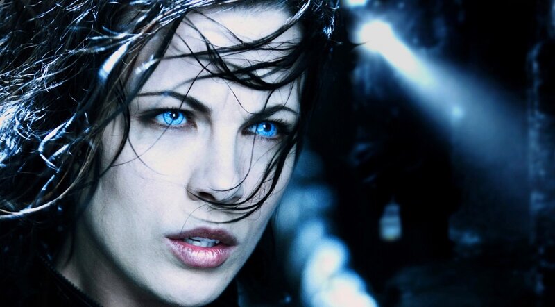 woman with blue eyes in dark setting