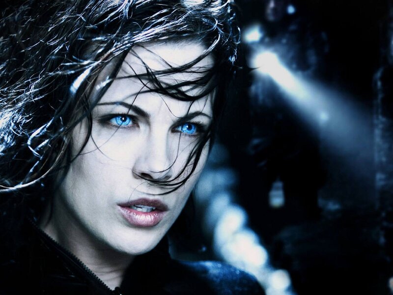 woman with blue eyes in dark setting