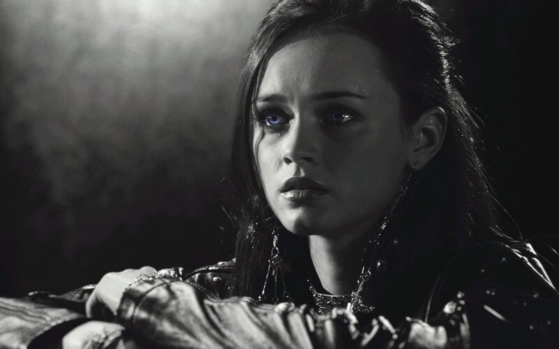 woman with blue eyes in dark setting
