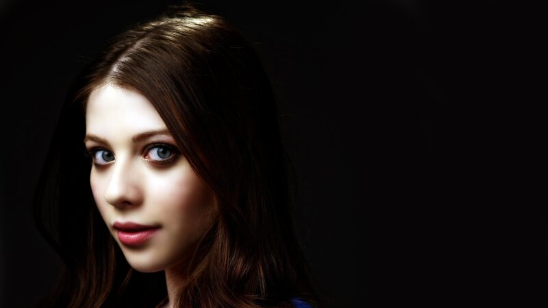 woman with blue eyes in dark setting
